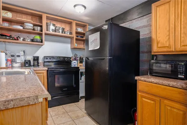 a view of a livingroom with furniture and a fireplace