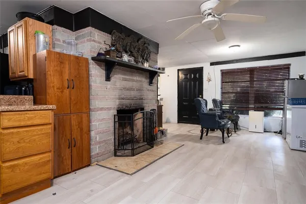 a view of a a dining room with furniture window and wooden floor