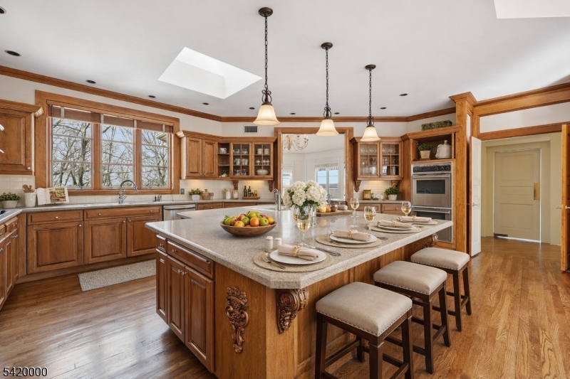29 Hilltop Road Kinnelon, NJ 07405 - Photo 13 of 50 a kitchen with a stove a table and chairs
