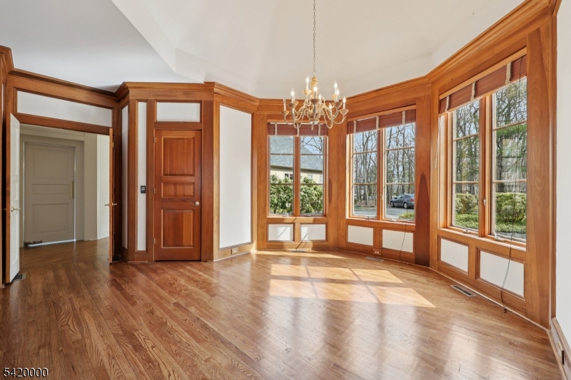29 Hilltop Road Kinnelon, NJ 07405 - Photo 15 of 50 a view of an empty room with wooden floor and a window
