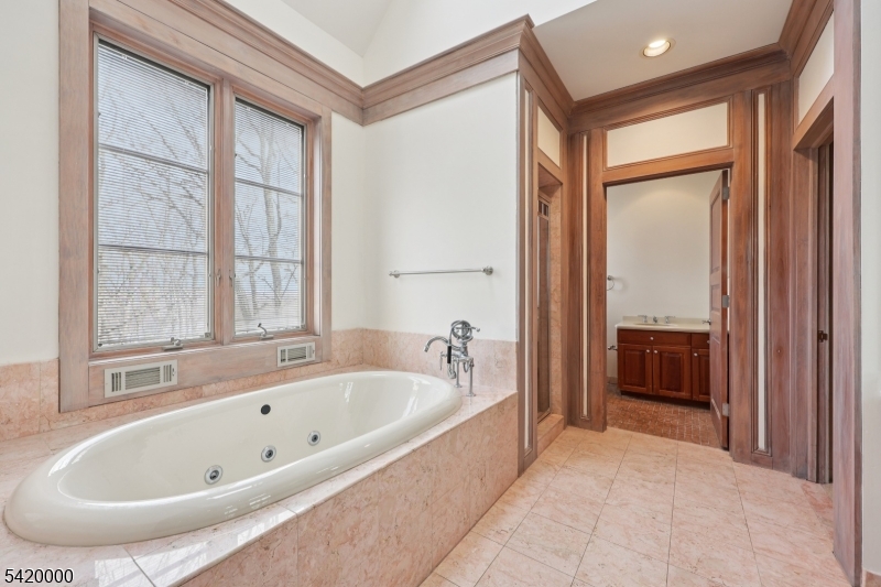 29 Hilltop Road Kinnelon, NJ 07405 - Photo 23 of 50 a bathroom with a bathtub and a shower