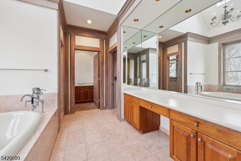 29 Hilltop Road Kinnelon, NJ 07405 - Photo 24 of 50 a spacious bathroom with a tub sink and mirror