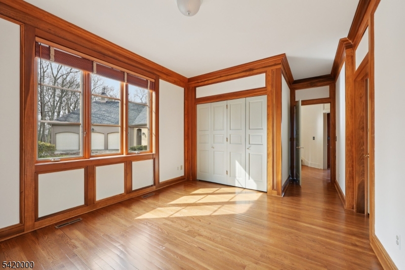 29 Hilltop Road Kinnelon, NJ 07405 - Photo 25 of 50 a view of empty room with wooden floor and fan