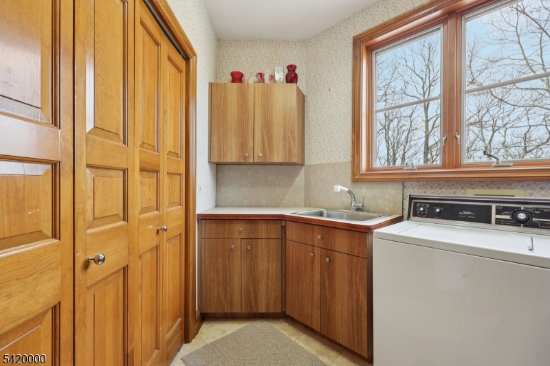 29 Hilltop Road Kinnelon, NJ 07405 - Photo 28 of 50 a kitchen with a stove a sink and a window