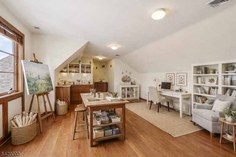 29 Hilltop Road Kinnelon, NJ 07405 - Photo 32 of 50 a living room with furniture and a wooden floor