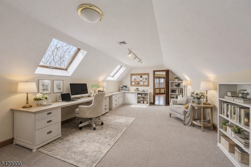 29 Hilltop Road Kinnelon, NJ 07405 - Photo 33 of 50 a workspace with a large window and a chair