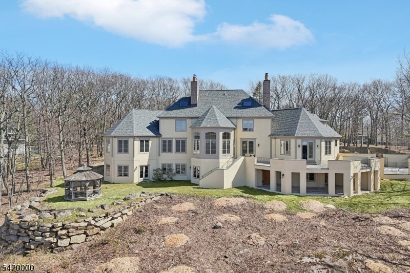 29 Hilltop Road Kinnelon, NJ 07405 - Photo 43 of 50 a view of a house with a yard and sitting area