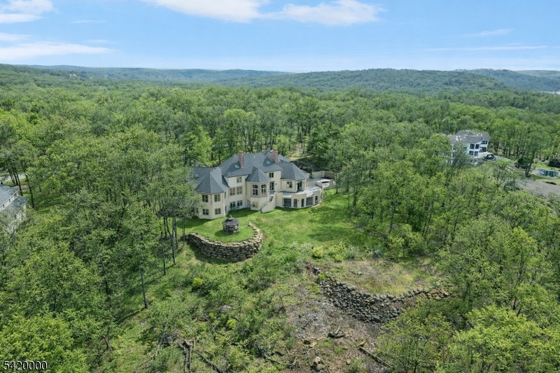 29 Hilltop Road Kinnelon, NJ 07405 - Photo 44 of 50 a view of a house with a yard