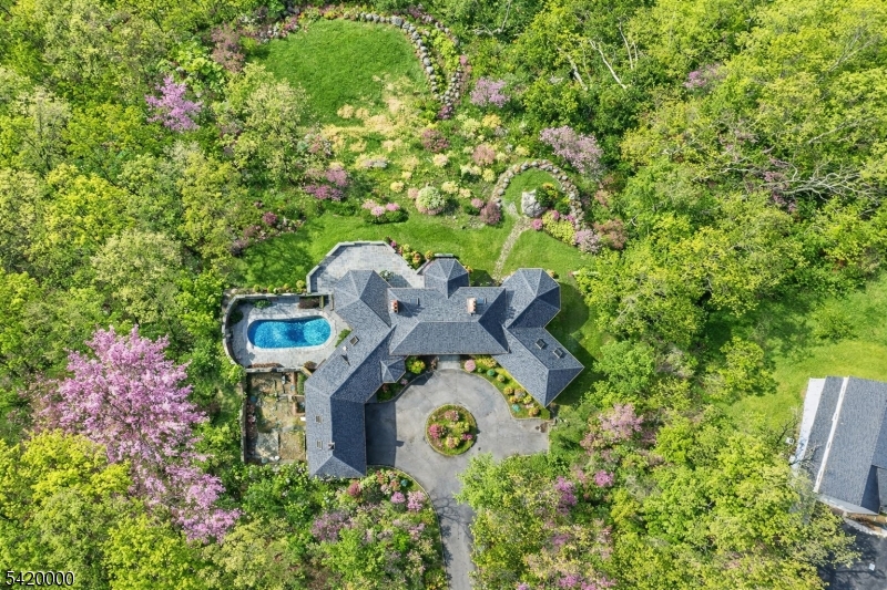 29 Hilltop Road Kinnelon, NJ 07405 - Photo 45 of 50 an aerial view of a house with garden space and street view