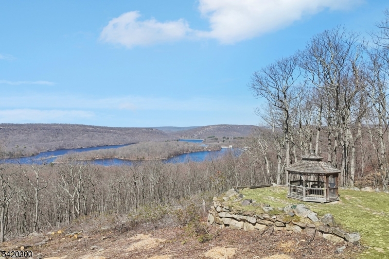 29 Hilltop Road Kinnelon, NJ 07405 - Photo 47 of 50 a view of a lake with a mountain in the back