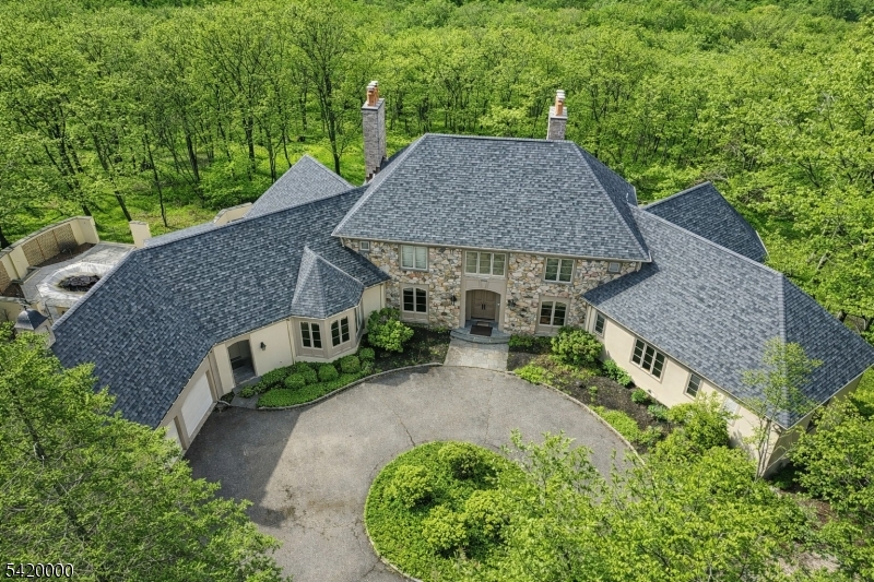 29 Hilltop Road Kinnelon, NJ 07405 - Photo 6 of 50 an aerial view of a house with yard and outdoor seating