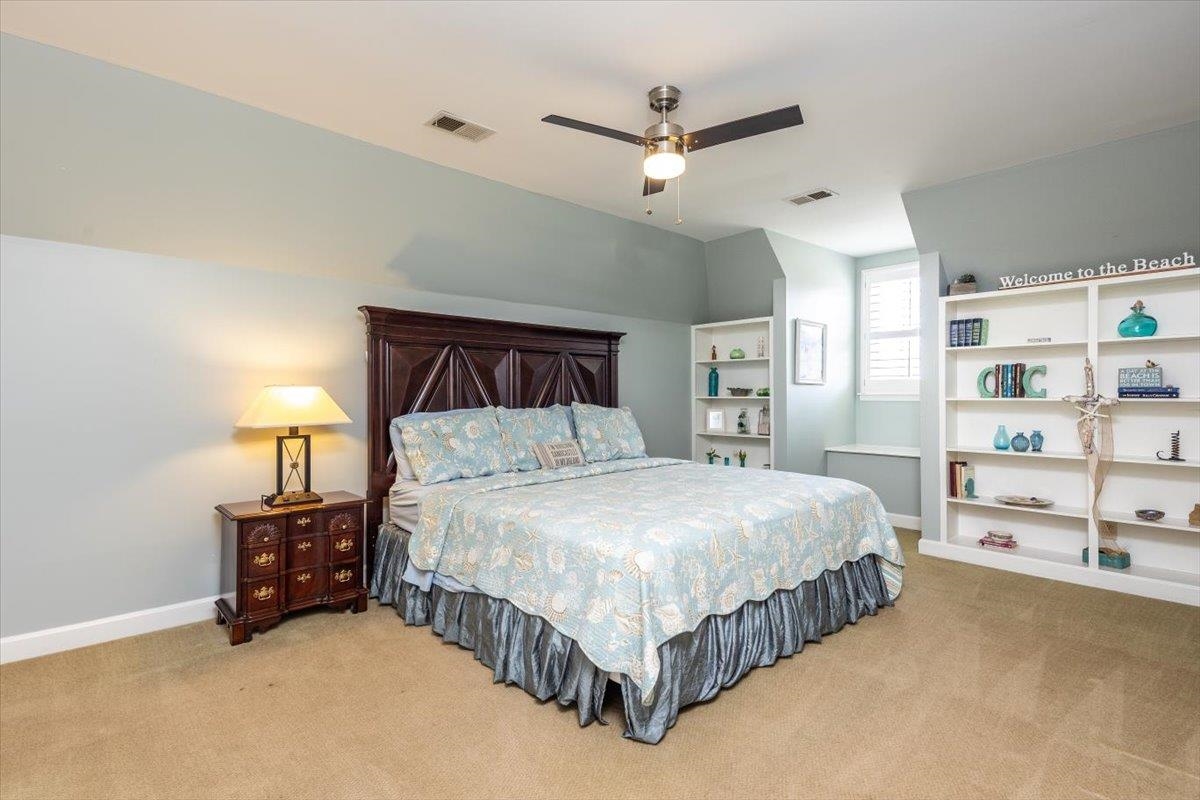 295 Spring Mill Road Collierville, TN 38017 - Photo 21 of 31 a bedroom with a bed chandelier and a window