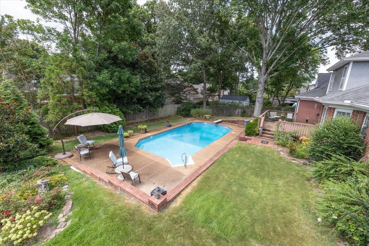 295 Spring Mill Road Collierville, TN 38017 - Photo 27 of 31 a view of a backyard with sitting area and lake view