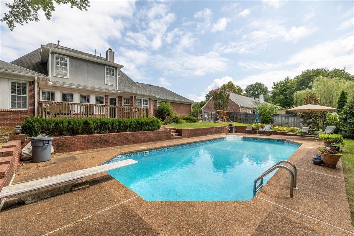295 Spring Mill Road Collierville, TN 38017 - Photo 30 of 31 a view of a swimming pool in front of residential houses