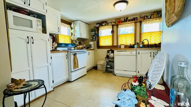 a kitchen with sink cabinets and appliances