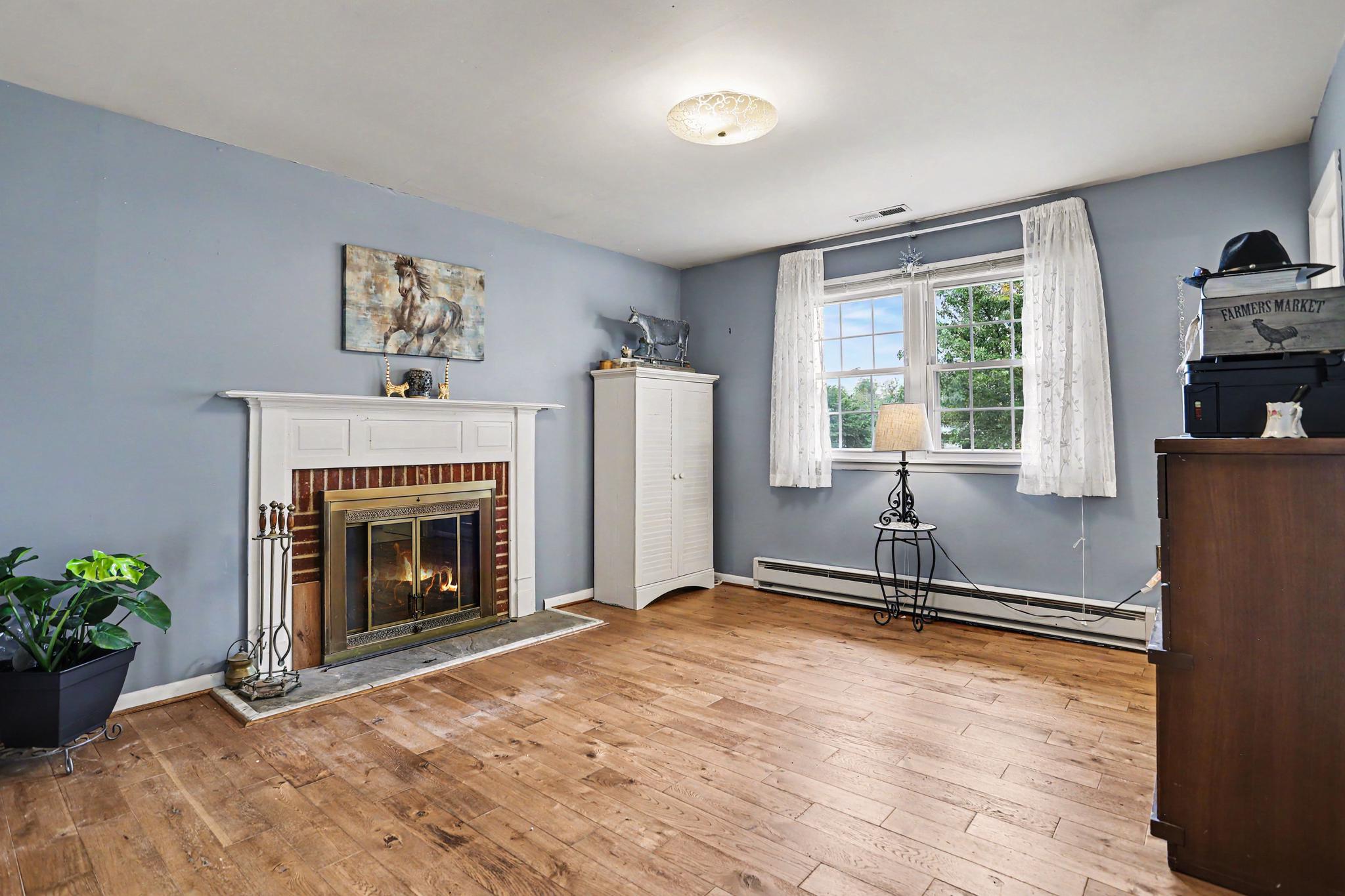 2226 Harney Road Littlestown, PA 17340 - Photo 18 of 40 a living room with furniture window and a fireplace
