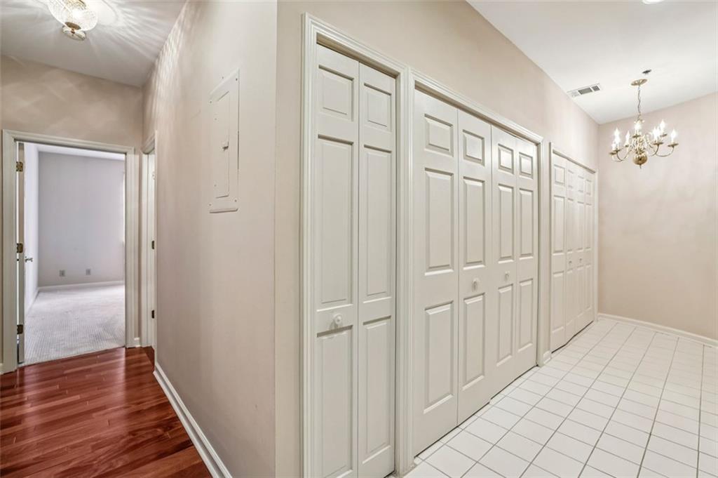 2499 Peachtree Street Northeast, Unit 406 Atlanta, GA 30305 - Photo 14 of 28 a view of a hallway with wooden floor and staircase