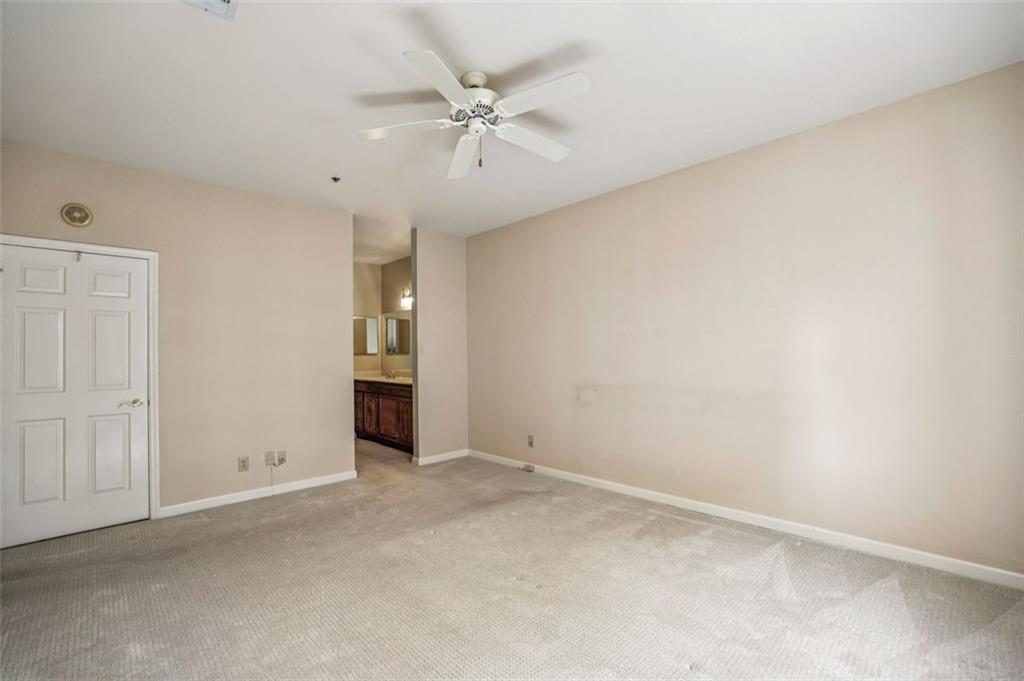 2499 Peachtree Street Northeast, Unit 406 Atlanta, GA 30305 - Photo 17 of 28 an empty room with fan and windows