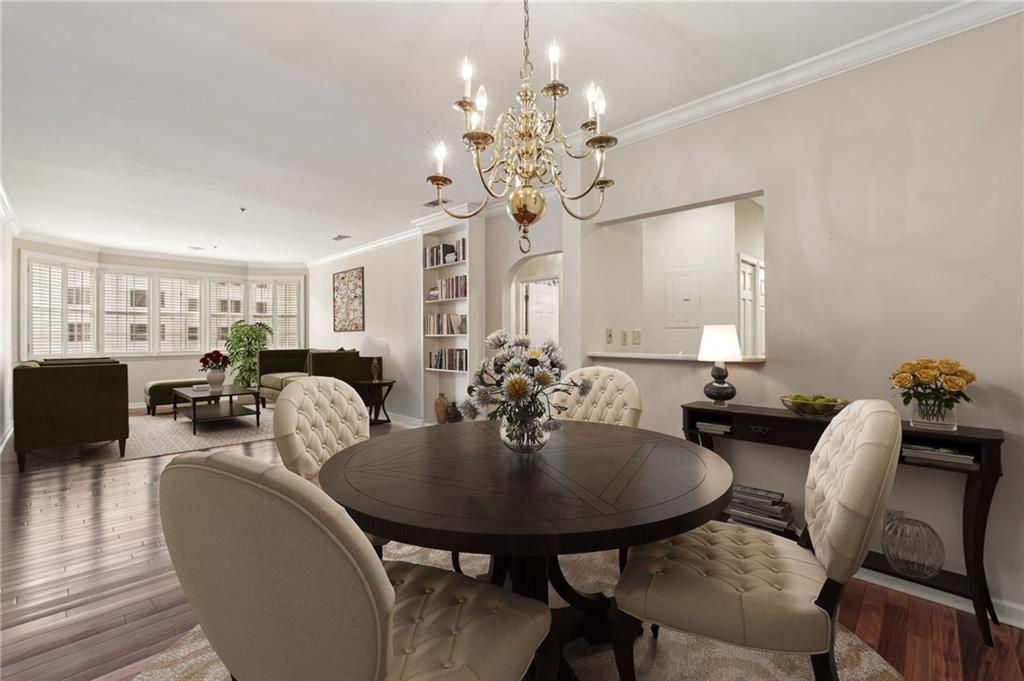 2499 Peachtree Street Northeast, Unit 406 Atlanta, GA 30305 - Photo 3 of 28 a view of a dining room with furniture and chandelier