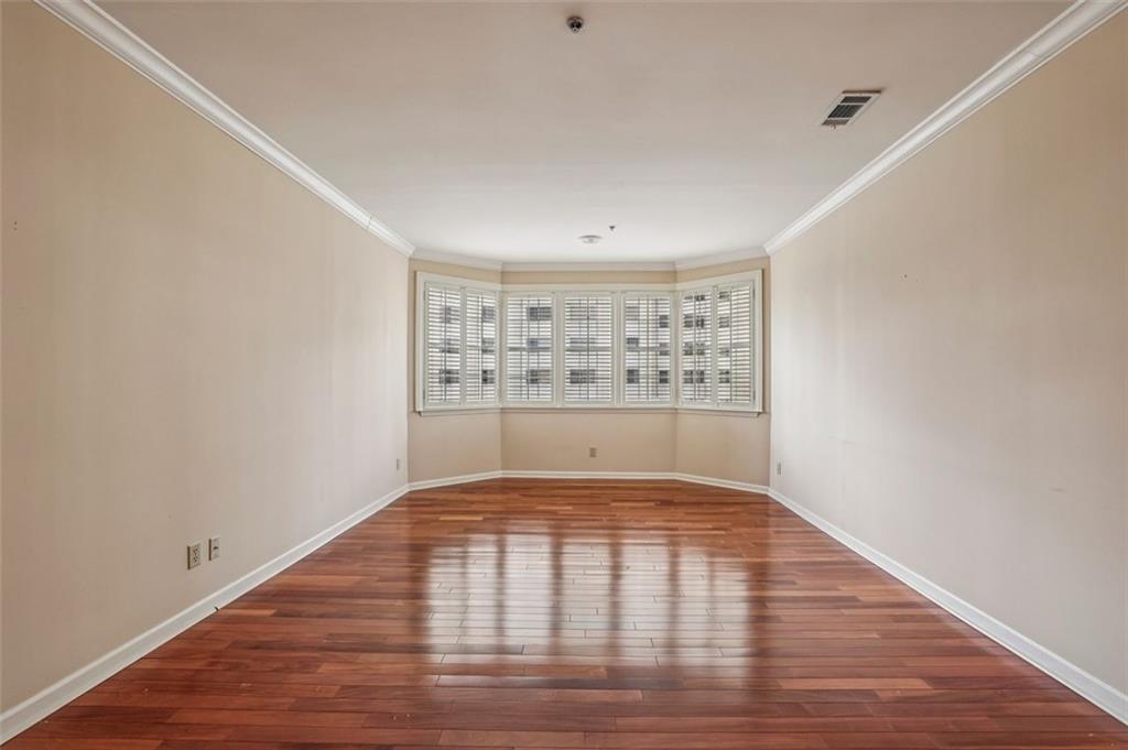 2499 Peachtree Street Northeast, Unit 406 Atlanta, GA 30305 - Photo 10 of 28 a view of wooden floor in an empty room
