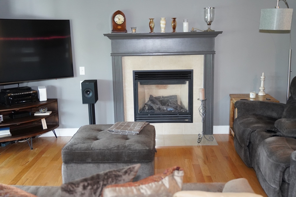 7 Turtle Hill Road, Unit B Ayer, MA 01432 - Photo 20 of 42 a living room with furniture and a fireplace