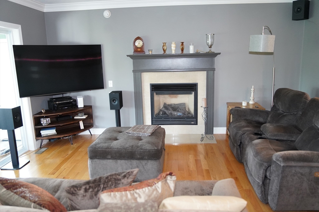 7 Turtle Hill Road, Unit B Ayer, MA 01432 - Photo 4 of 42 a living room with furniture and a flat screen tv