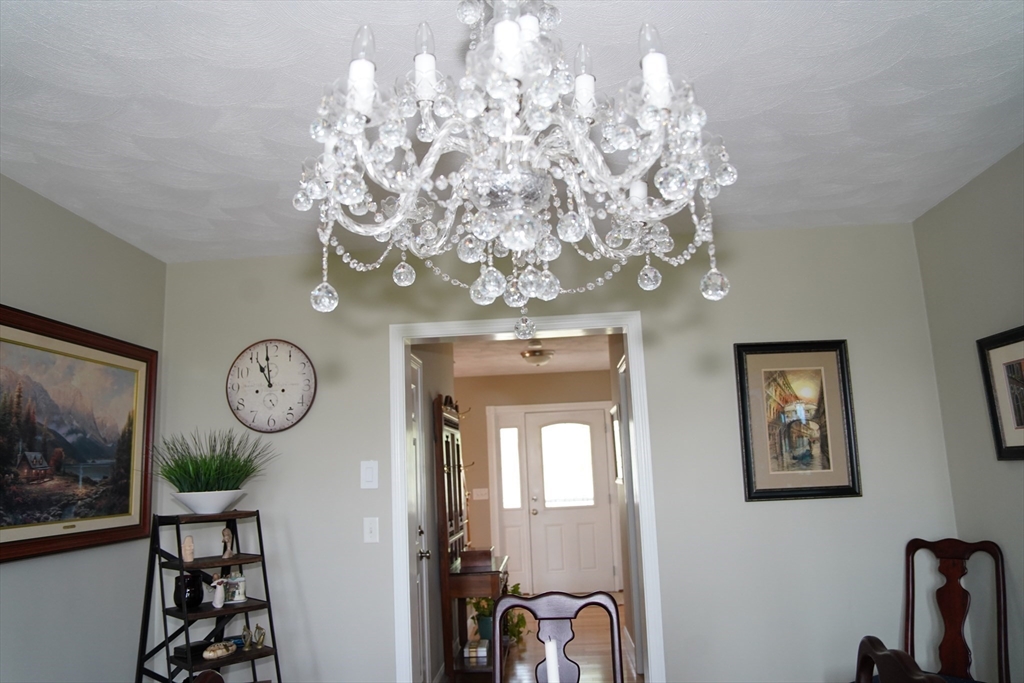 7 Turtle Hill Road, Unit B Ayer, MA 01432 - Photo 42 of 42 a view of a hallway with chandelier fan
