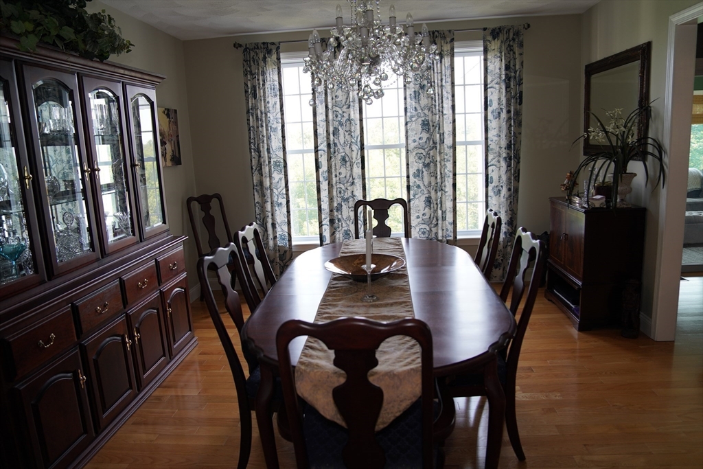 7 Turtle Hill Road, Unit B Ayer, MA 01432 - Photo 5 of 42 a view of a dining room with furniture window and wooden floor