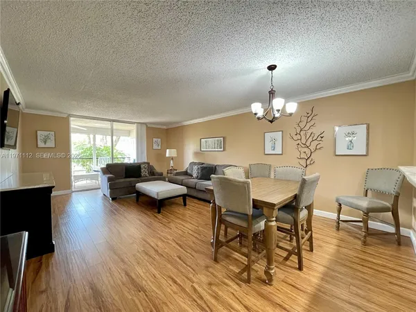 a living room with furniture dining table and a fireplace