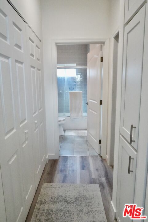1157 South Point View Street Los Angeles, CA 90035 - Photo 13 of 15 a bathroom with a glass door shower