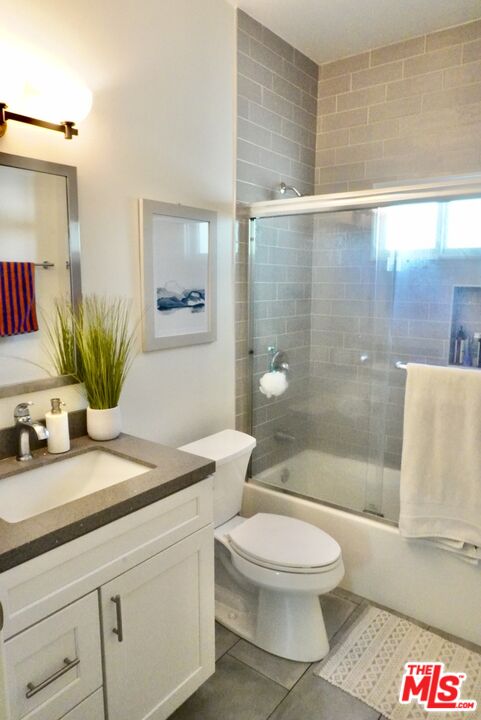 1157 South Point View Street Los Angeles, CA 90035 - Photo 14 of 15 a bathroom with a sink a toilet and shower