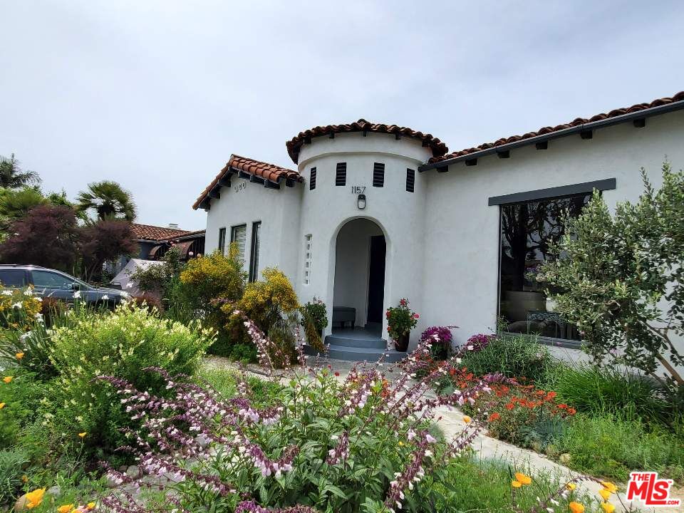 1157 South Point View Street Los Angeles, CA 90035 - Photo 15 of 15 a front view of a house with a yard