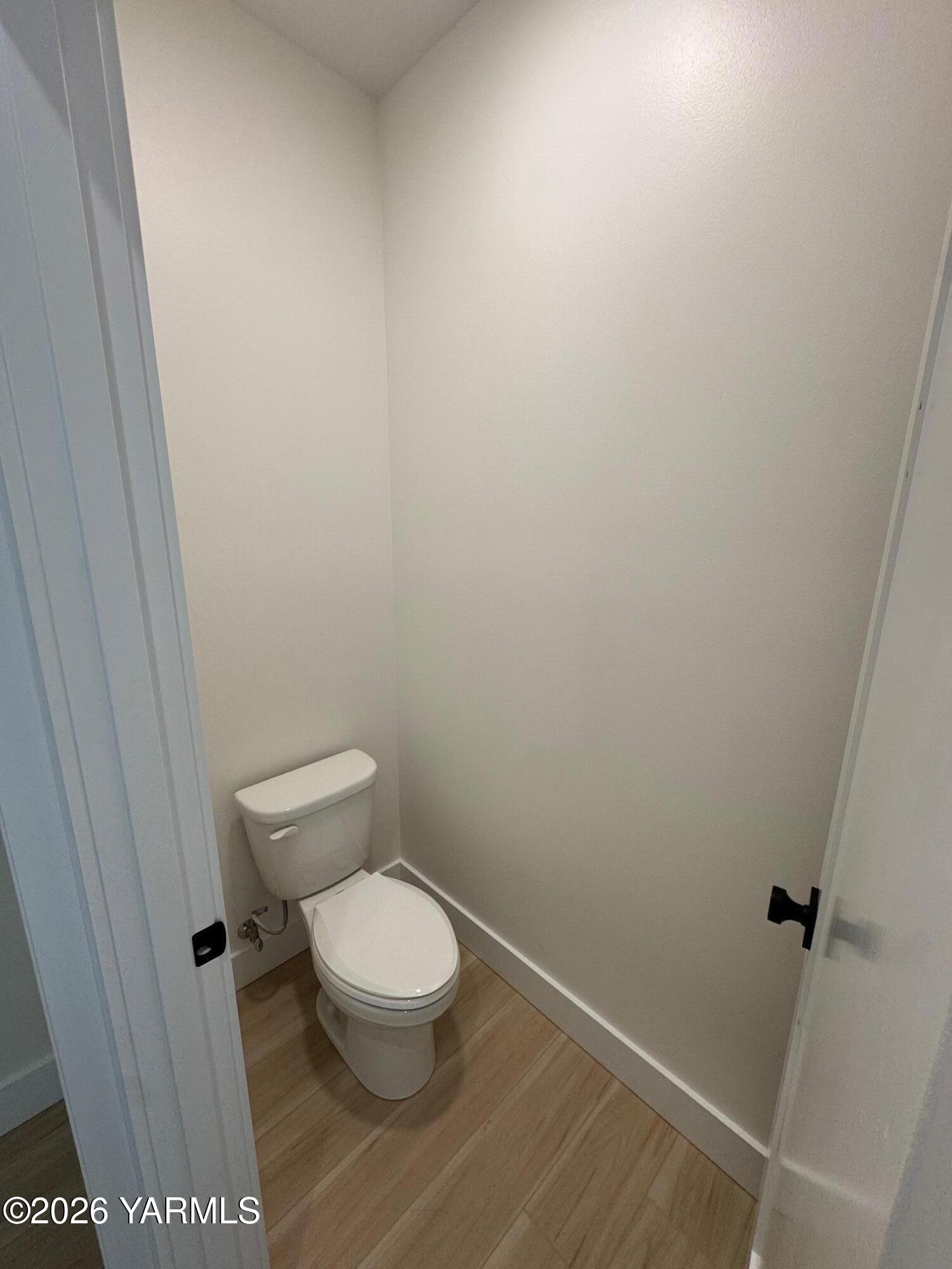 304 6th Street Zillah, WA 98953 - Photo 13 of 29 a white toilet sitting next to a shower