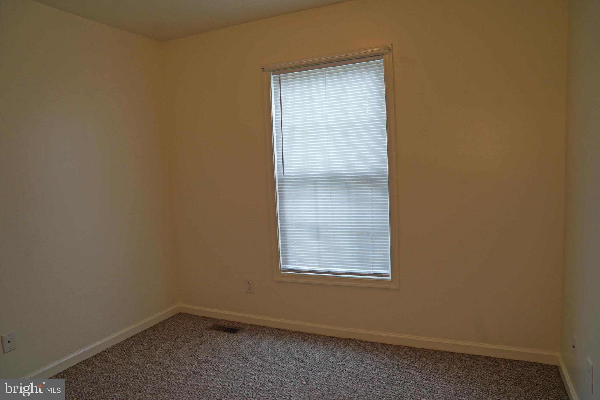 122 Sinker Drive Inwood, WV 25428 - Photo 11 of 28 an empty room with a window