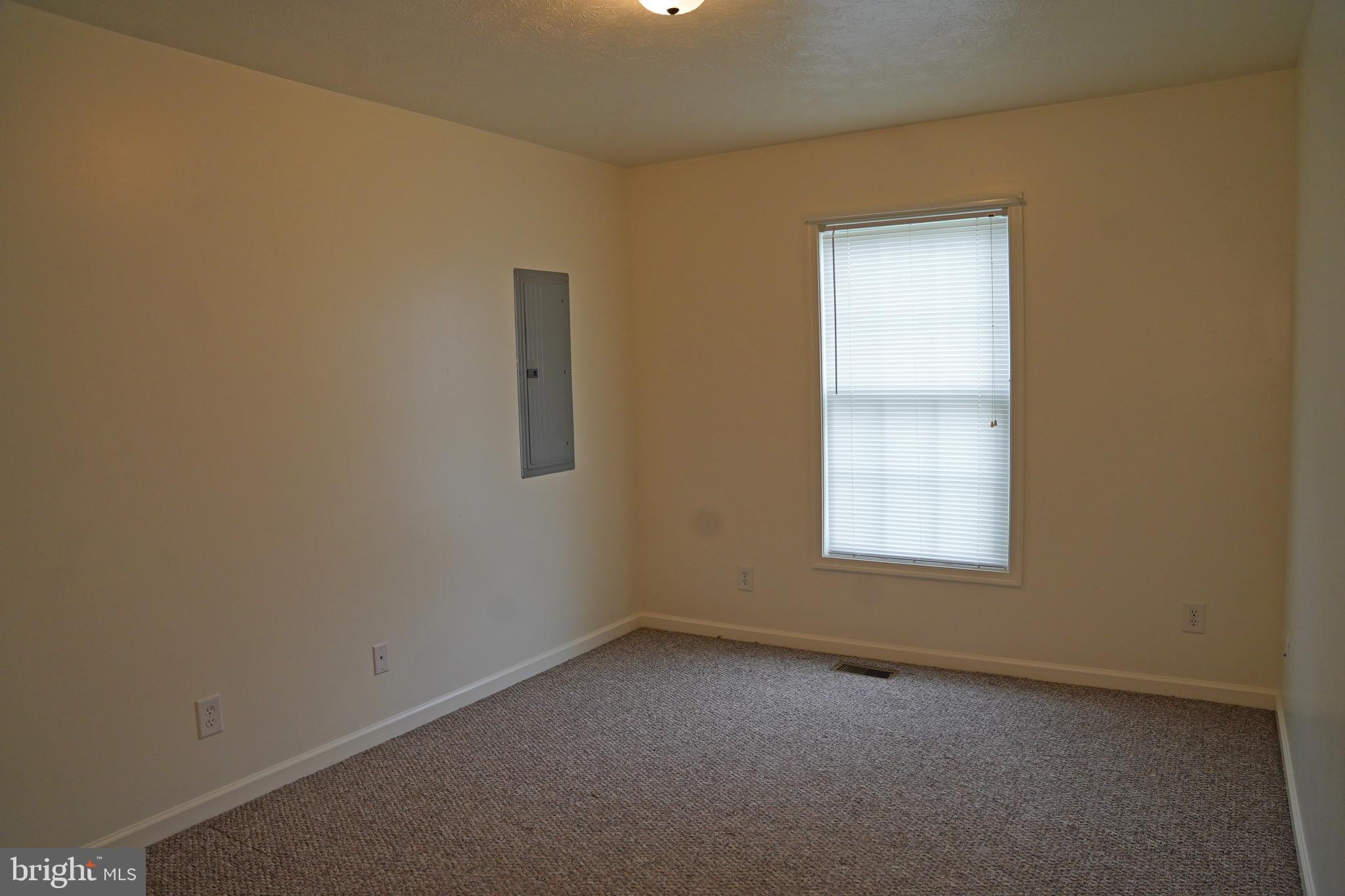 122 Sinker Drive Inwood, WV 25428 - Photo 14 of 28 an empty room with a window