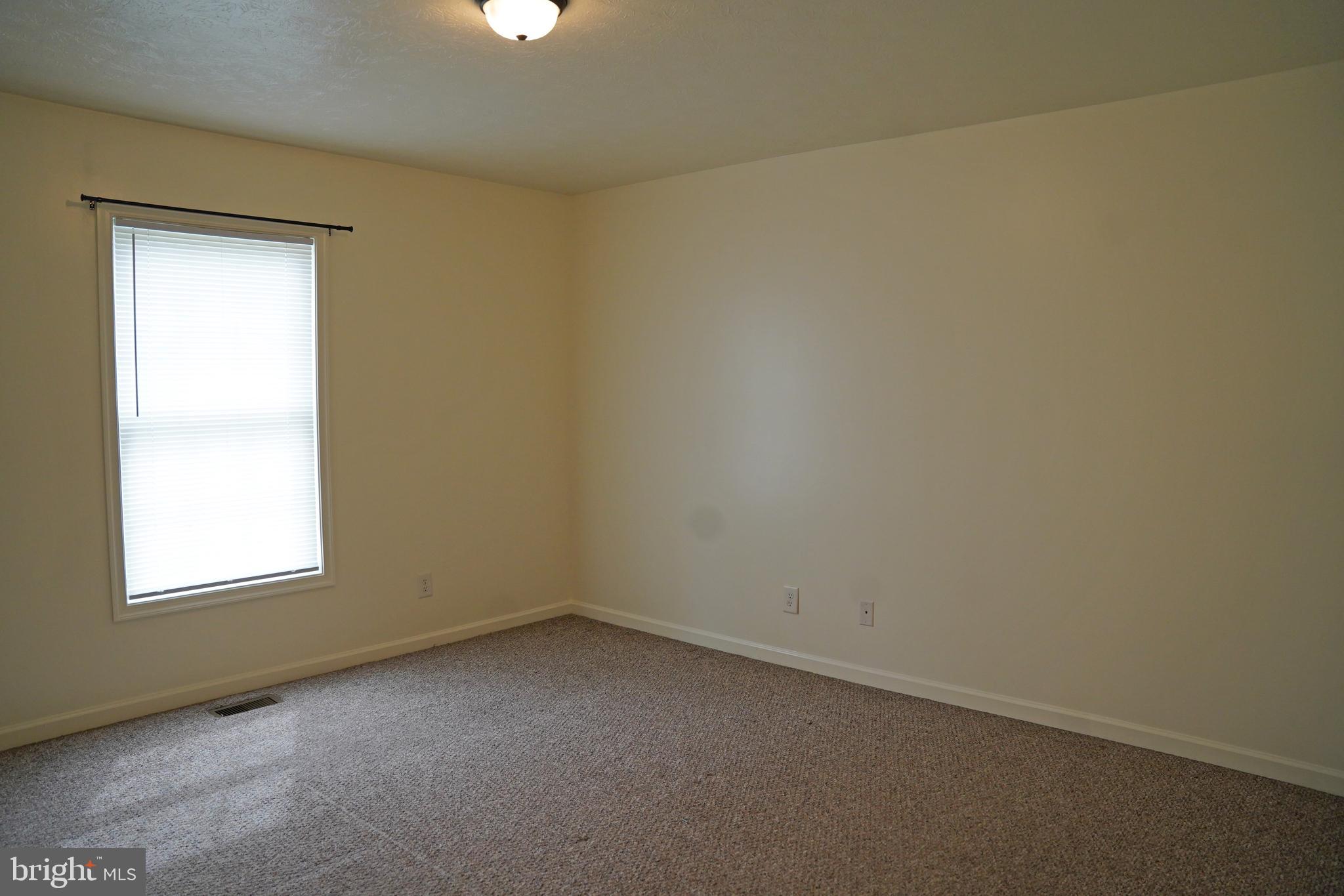 122 Sinker Drive Inwood, WV 25428 - Photo 16 of 28 an empty room with a window