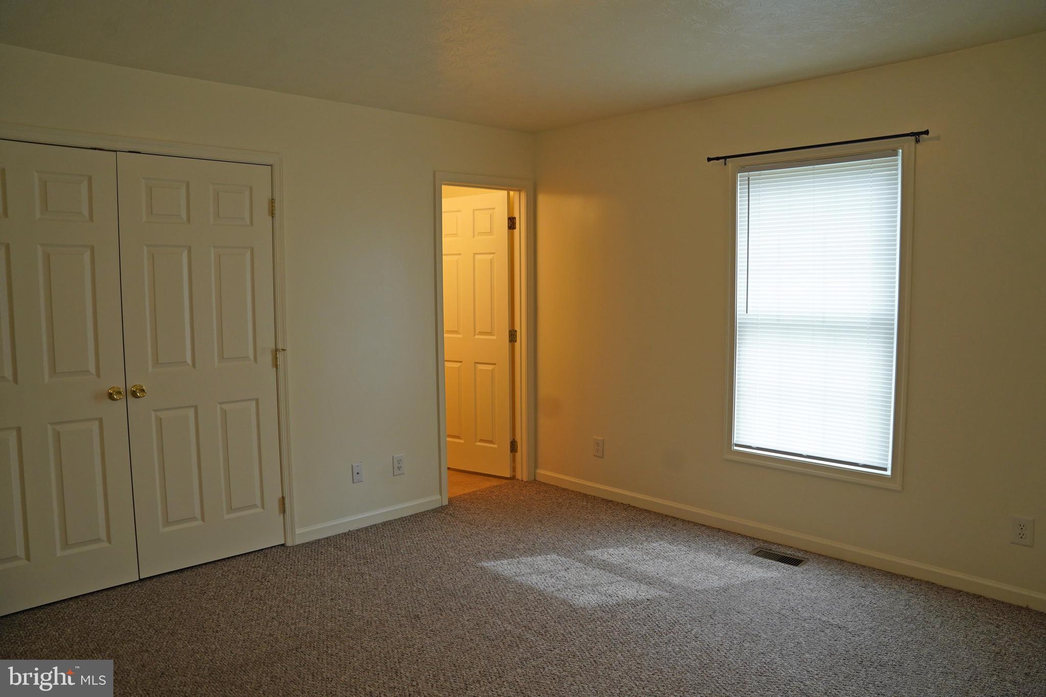 122 Sinker Drive Inwood, WV 25428 - Photo 17 of 28 an empty room with windows