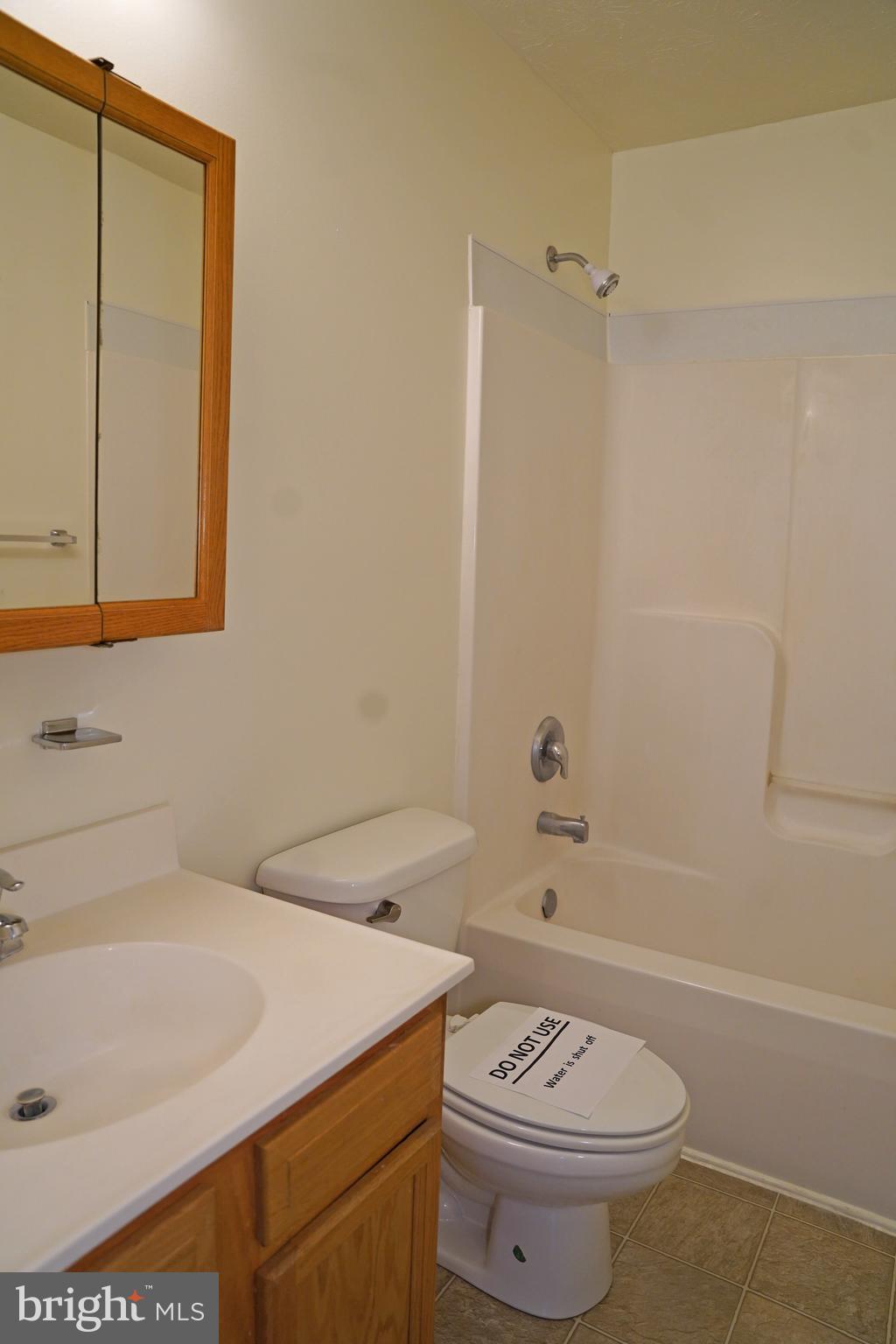 122 Sinker Drive Inwood, WV 25428 - Photo 19 of 28 a bathroom with a sink a toilet and shower