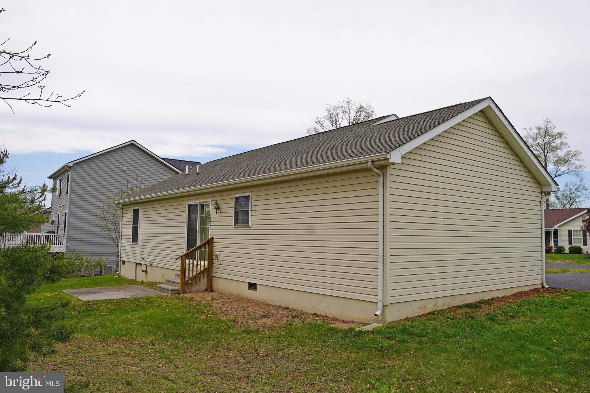 122 Sinker Drive Inwood, WV 25428 - Photo 25 of 28 a view of a white house next to a yard