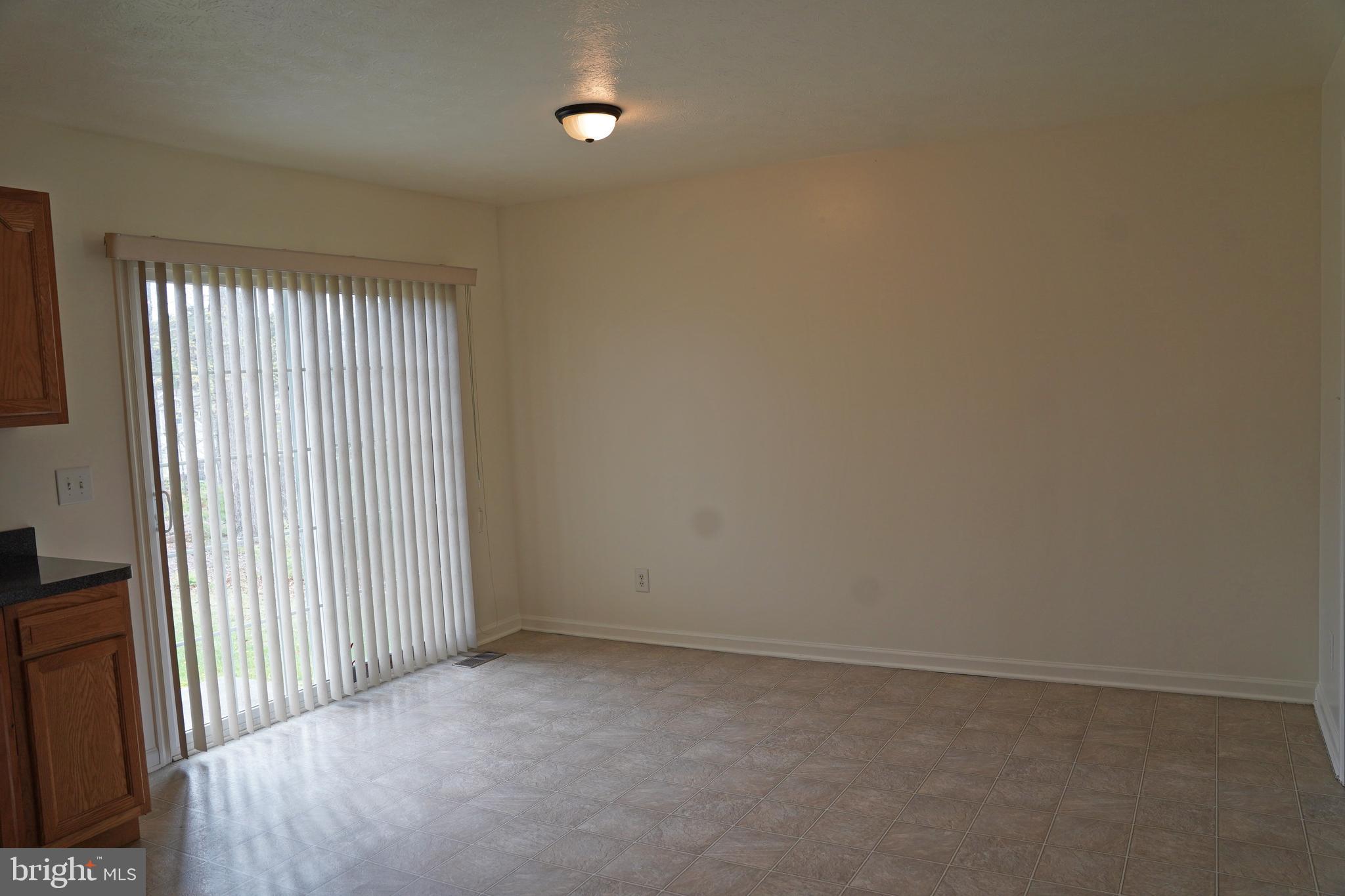 122 Sinker Drive Inwood, WV 25428 - Photo 6 of 28 an empty room with windows