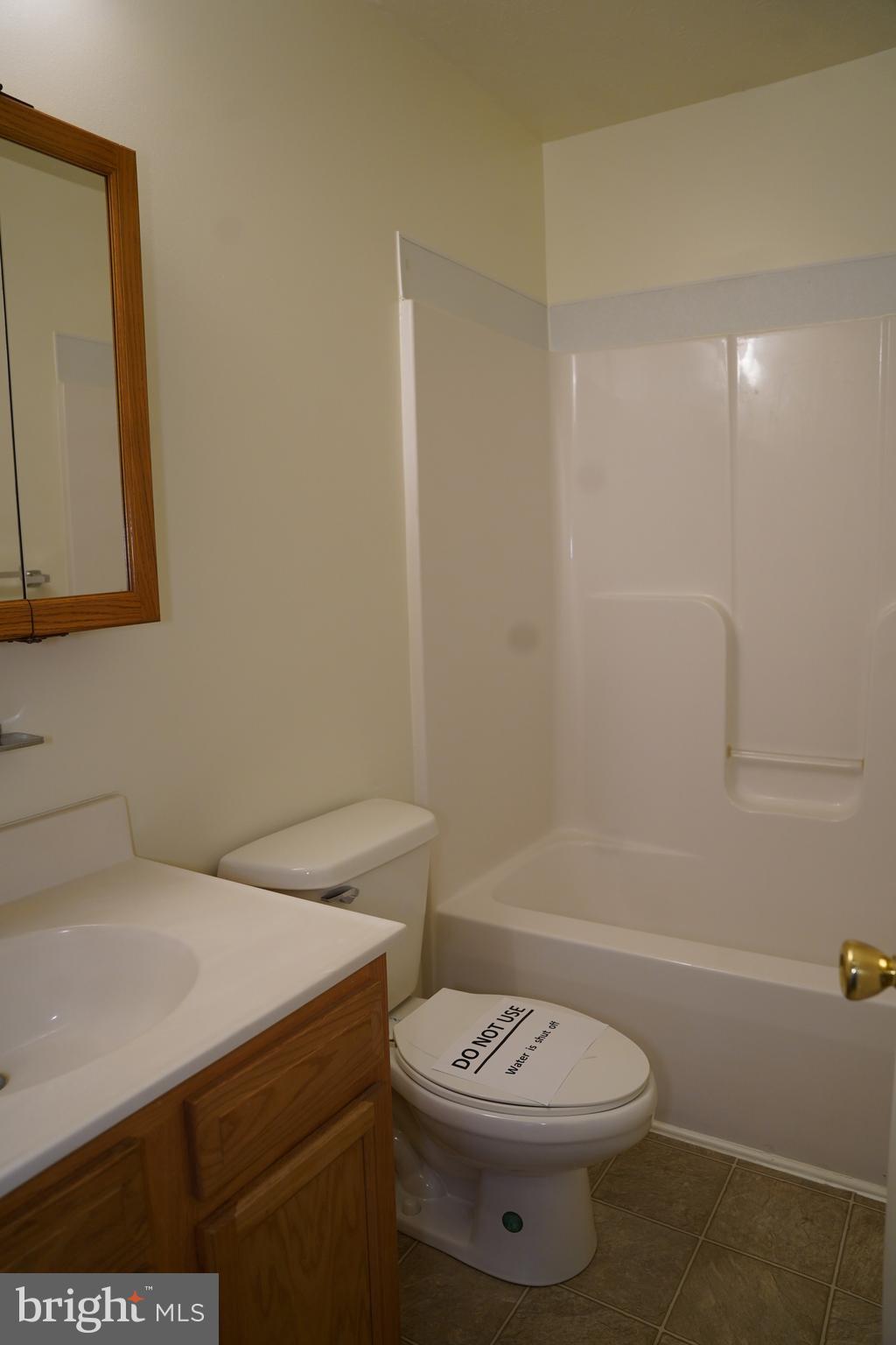 122 Sinker Drive Inwood, WV 25428 - Photo 10 of 28 a bathroom with a toilet a sink and bathtub