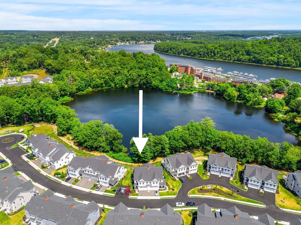 32 Cutter Lane, Unit 32 Amesbury, MA 01913 - Photo 1 of 37 an aerial view of lake and residential houses with outdoor space