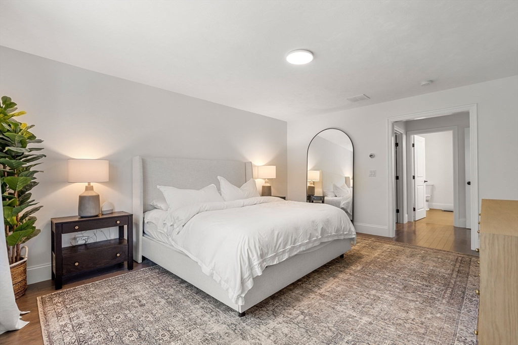 32 Cutter Lane, Unit 32 Amesbury, MA 01913 - Photo 15 of 37 a bedroom with a bed and a couch