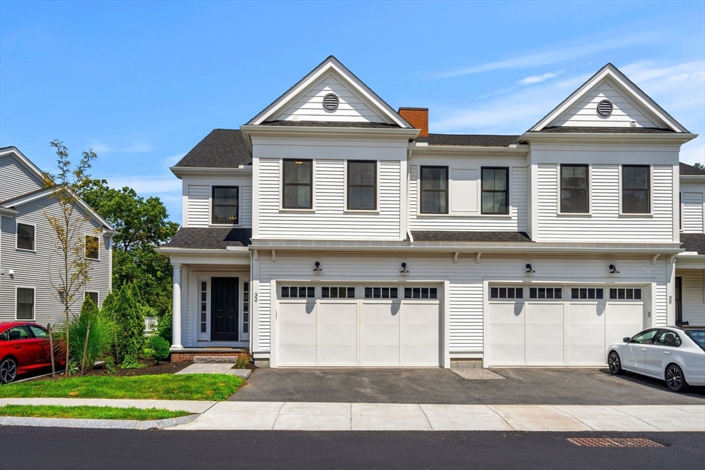 32 Cutter Lane, Unit 32 Amesbury, MA 01913 - Photo 2 of 37 a front view of a house with a yard