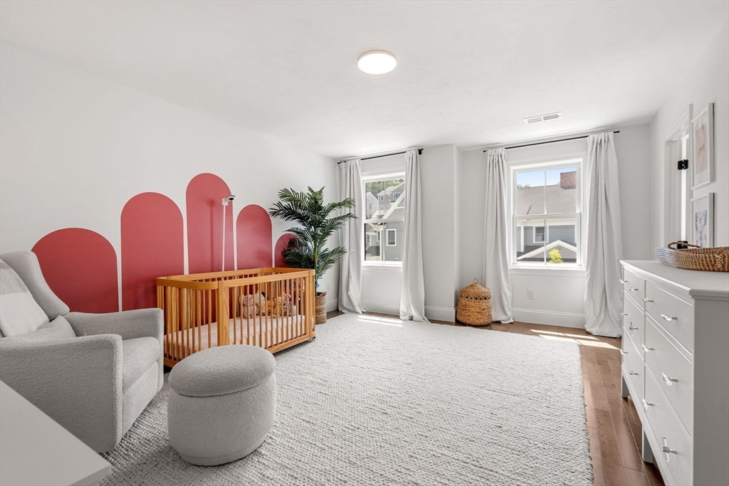 32 Cutter Lane, Unit 32 Amesbury, MA 01913 - Photo 22 of 37 a bedroom with furniture and a couch