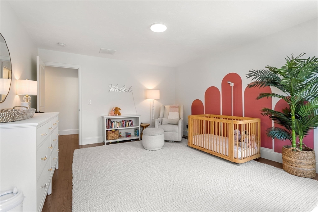 32 Cutter Lane, Unit 32 Amesbury, MA 01913 - Photo 23 of 37 a bedroom with furniture and a baby crib