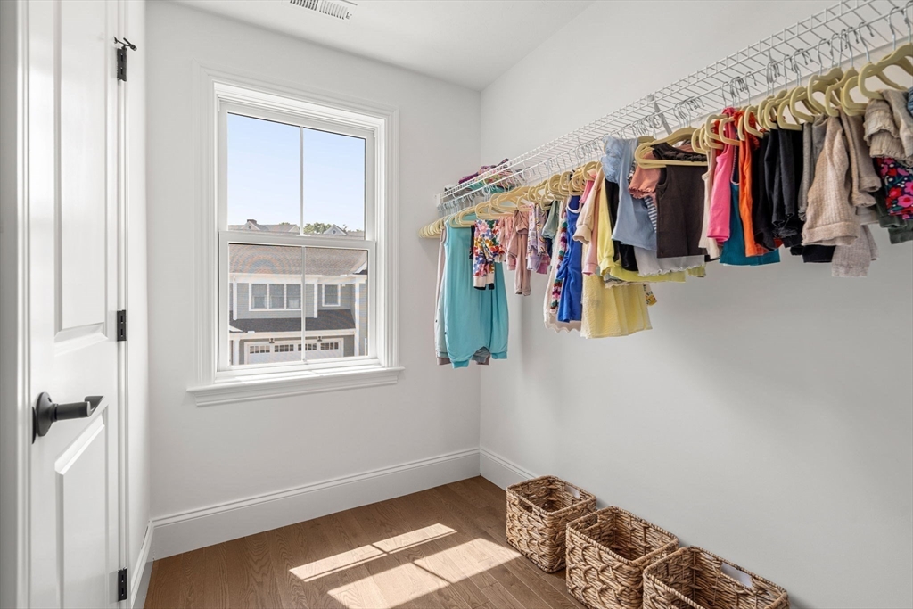 32 Cutter Lane, Unit 32 Amesbury, MA 01913 - Photo 25 of 37 a view of walk in closet with clothes