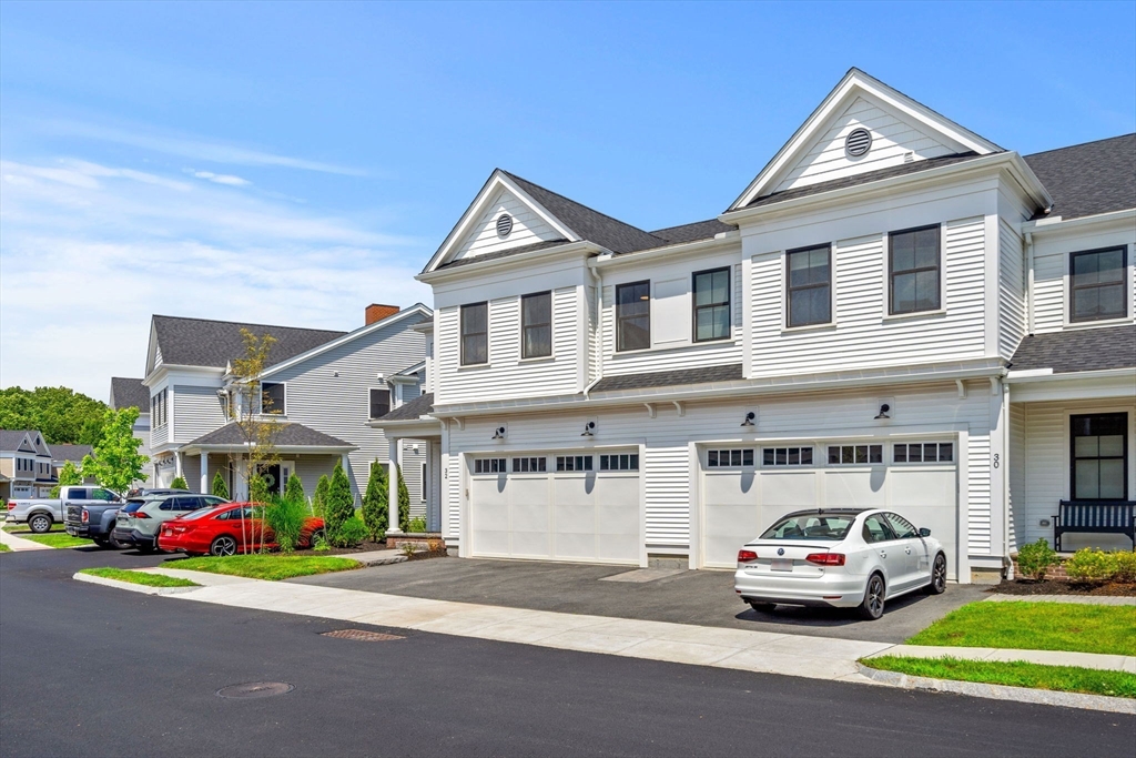 32 Cutter Lane, Unit 32 Amesbury, MA 01913 - Photo 3 of 37 a view of street with cars and a white house