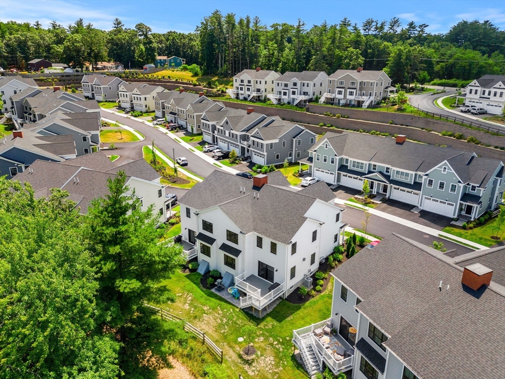 32 Cutter Lane, Unit 32 Amesbury, MA 01913 - Photo 32 of 37 an aerial view of a house with a swimming pool