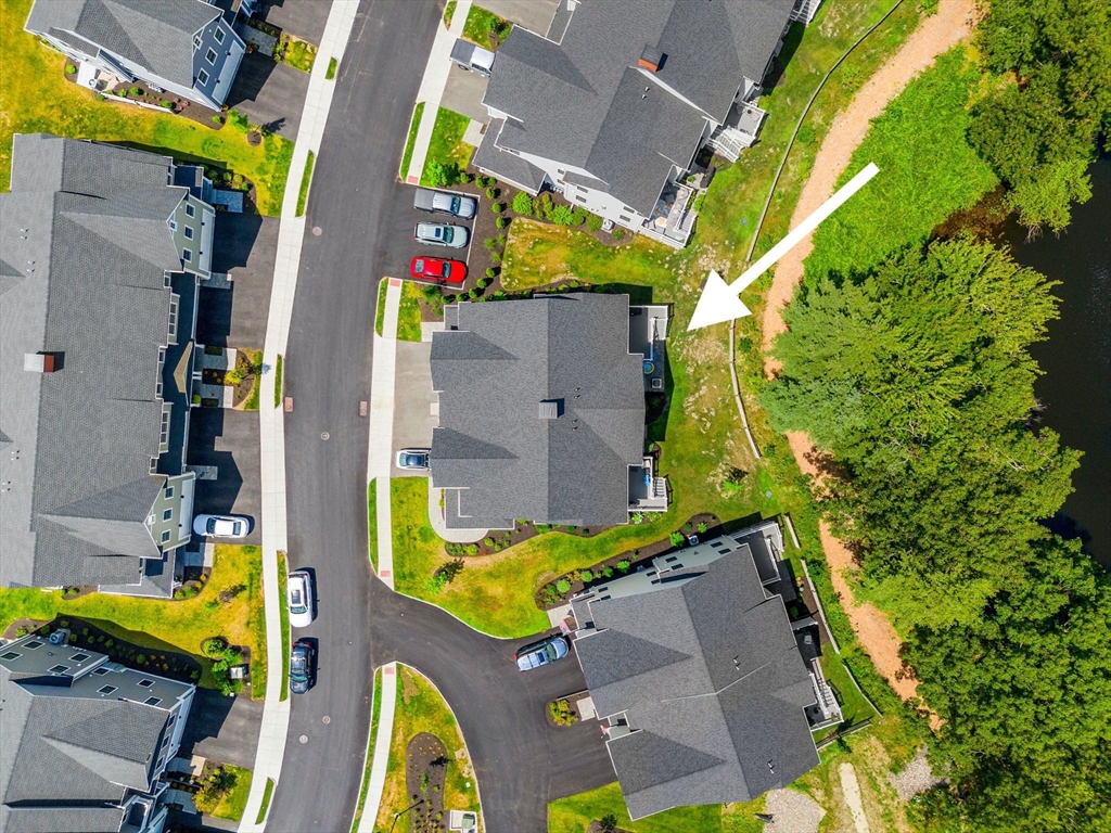 32 Cutter Lane, Unit 32 Amesbury, MA 01913 - Photo 34 of 37 an aerial view of residential house with outdoor space and swimming pool